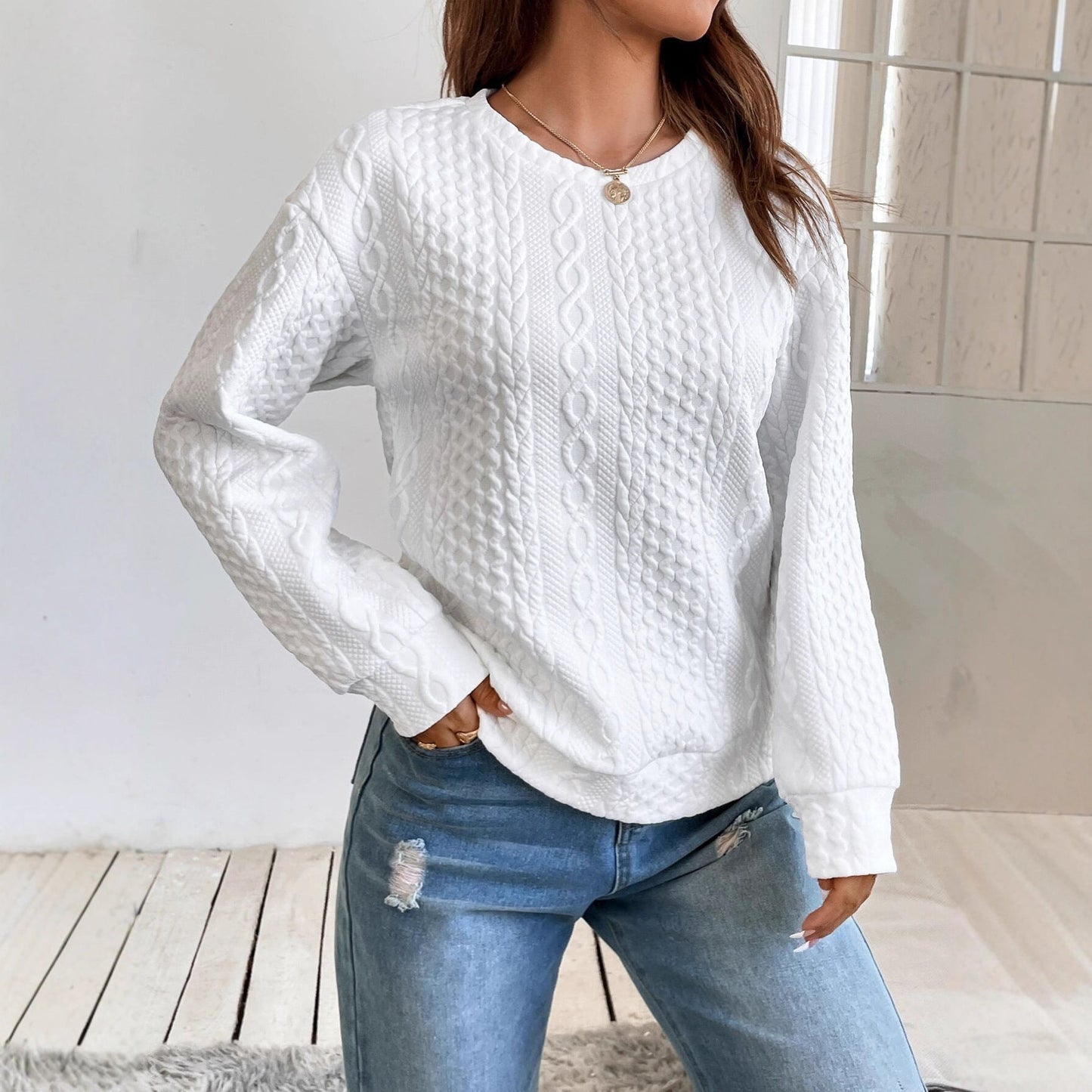 Women's knit sweater with textured surface and elegant round neckline NOVAE