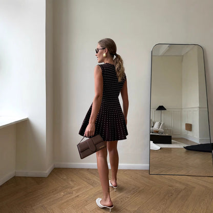 Women's knit dress with elegant rib pattern and feminine silhouette NOVAE