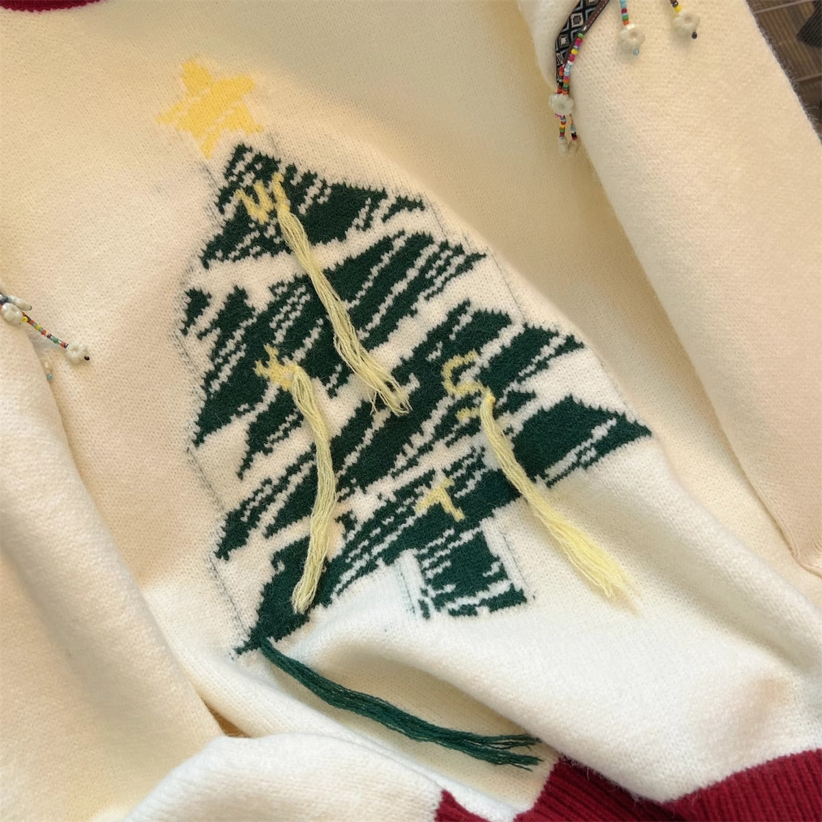 Women's festive knit sweater with Christmas tree motif and playful accents NOVAE