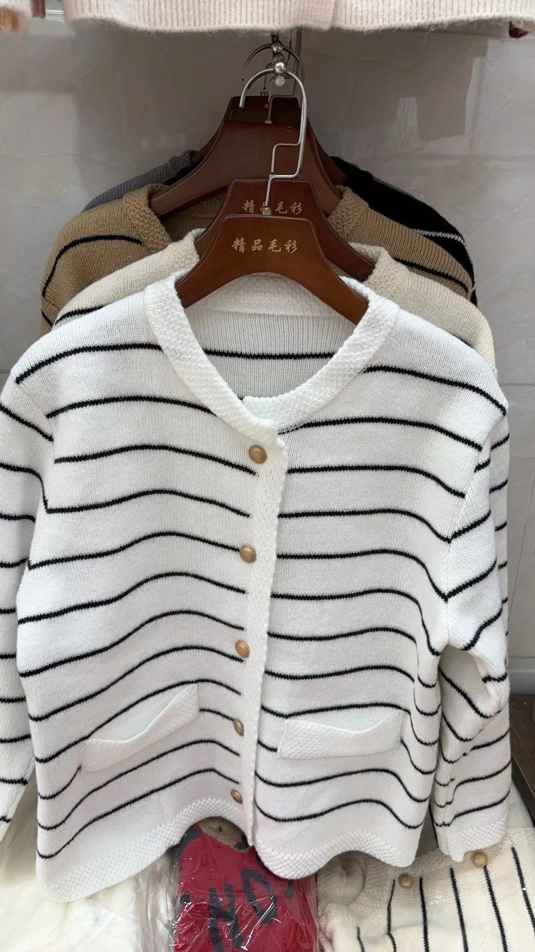Women's cozy cardigan with fine stripes and practical pockets NOVAE