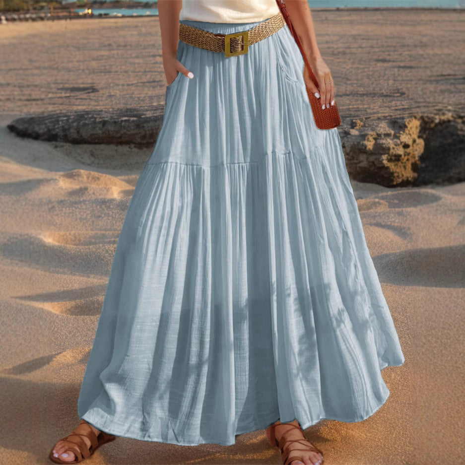 Women's wide-flared maxi skirt with elegant pleats and practical pockets NOVAE