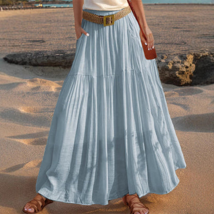 Women's wide-flared maxi skirt with elegant pleats and practical pockets NOVAE