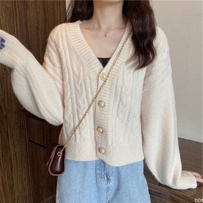 Women's cardigan with elegant cable knit pattern and high-quality button details NOVAE