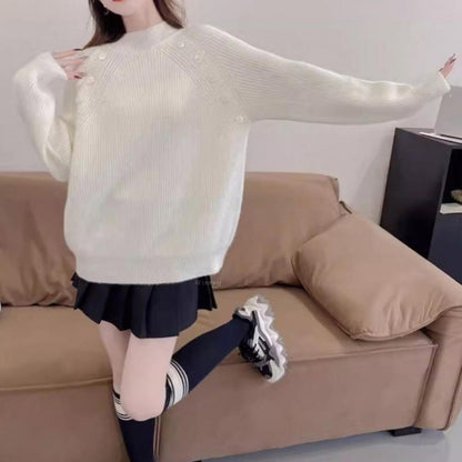 Women's chunky knit sweater with modern stand-up collar and button details NOVAE