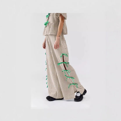 Women's wide-leg checked trousers with decorative lacing details NOVAE