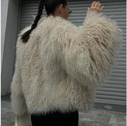 Women's fluffy faux fur jacket in a long cut with wide flared sleeves NOVAE