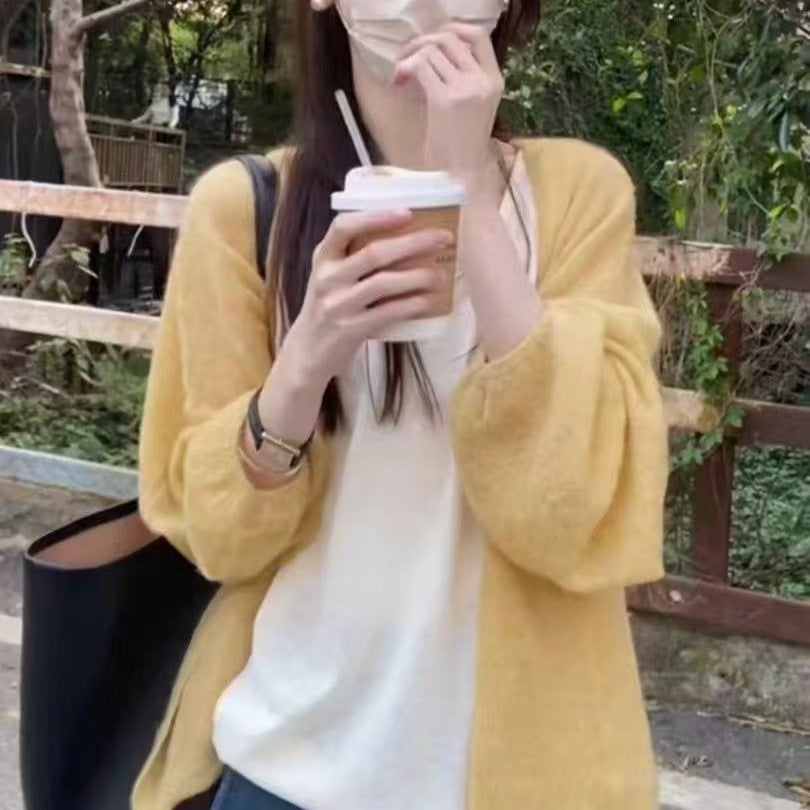 Women's fluffy cardigan with a relaxed fit and soft sleeves NOVAE