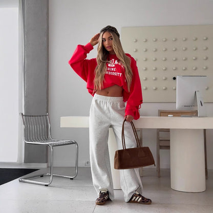 Women's cropped hoodie with creative cut details and large NOVAE lettering