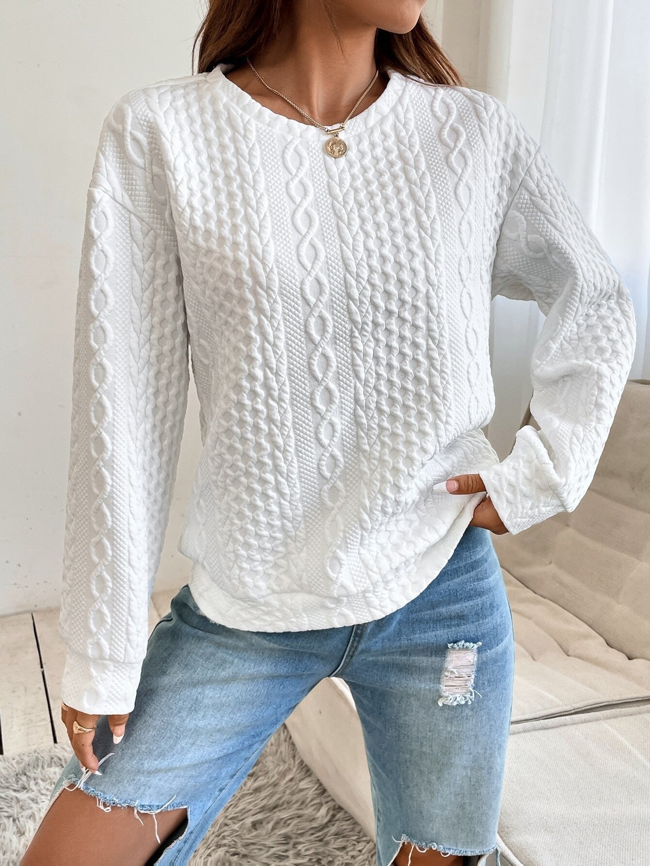 Women's knit sweater with textured surface and elegant round neckline NOVAE