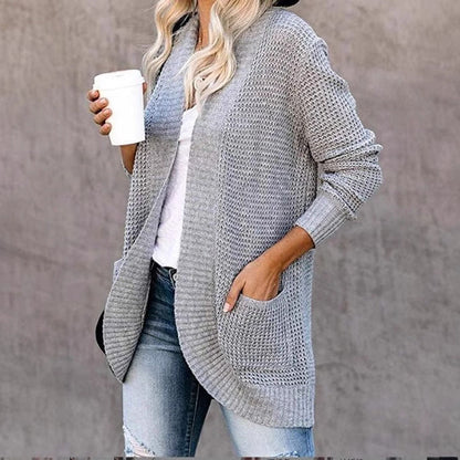 Women's knitted cardigan with practical pockets and airy structure NOVAE