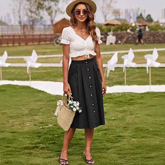 Women's midi skirt with button placket and practical pockets NOVAE