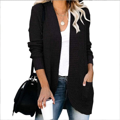 Women's knitted cardigan with practical pockets and airy structure NOVAE