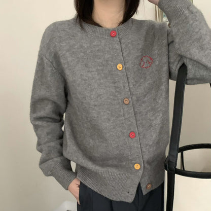 Women's cozy cardigan with buttoned neckline and embroidered motif NOVAE