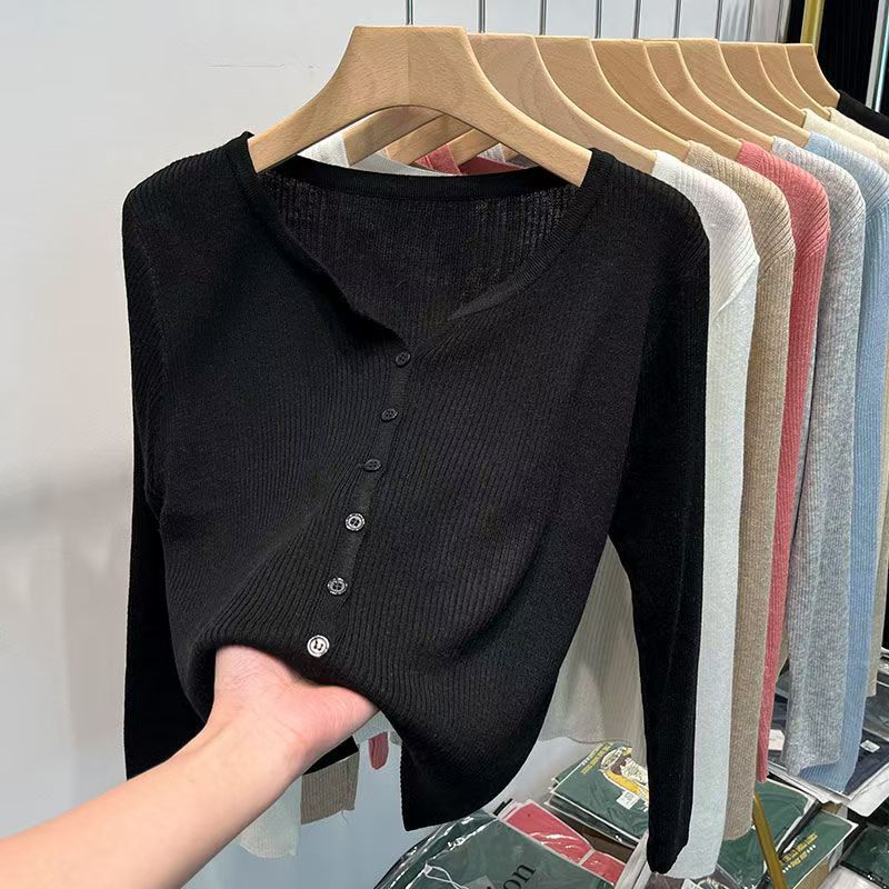 Women's figure-hugging cardigan with elegant button closure and fine ribbed texture NOVAE