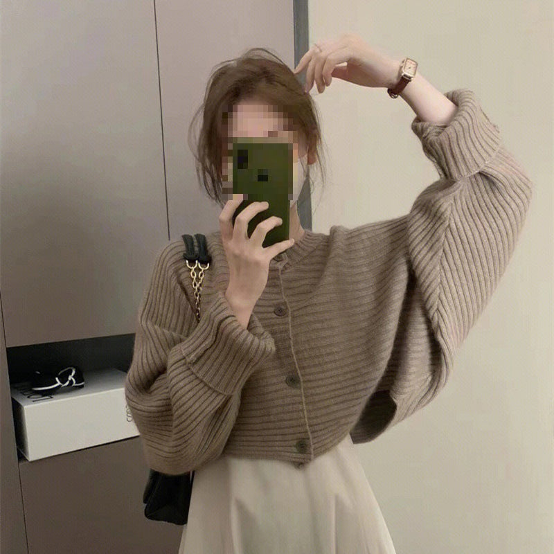 Women's fashionable knitted throw with button detail and structured design NOVAE