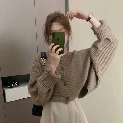 Women's fashionable knitted throw with button detail and structured design NOVAE